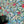 Sybille wallpaper by Claire de Quénetain in green and blue, a hand-painted floral design in a styled room setting