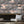 Club Safari wallpaper by Brand McKenzie in dusky pink, detail of a lush safari scene
