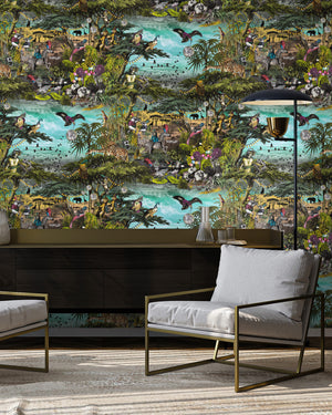 Club Safari wallpaper by Brand McKenzie in green and turquoise, a lush safari scene behind a sofa in a living room