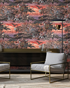 Club Safari wallpaper by Brand McKenzie in orange and pink, a lush safari scene behind a sofa in a living room