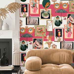 Connecting Frames wallpaper by Brand McKenzie in pink, a gallery wall of framed portraits in a living room