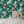 Cosmic Groove wallpaper by Brand McKenzie in dark green, detail of retro figures floating in space