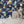 Cosmic Groove wallpaper by Brand McKenzie in navy, retro figures floating in space beside a fireplace