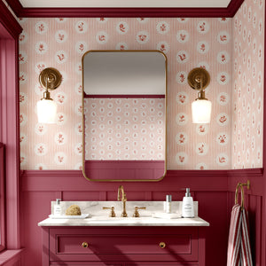 Cottage Ditsy Stripe wallpaper by Studio Le Cocq in pink, ditsy flower roundels on stripes on a bathroom wall