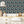Crab Cabana wallpaper by Brand McKenzie in blue, crabs under scalloped arches in a kitchen