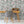Curious Skies wallpaper by Brand McKenzie in pink and aqua, hot air balloons and creatures in the clouds above a work desk