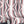 Deco Prism wallpaper by Liberty James Studio in pink, sample roll showing art deco wave stripes