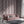 Deco Prism wallpaper by Liberty James Studio in pink, art deco wave stripes in a living room