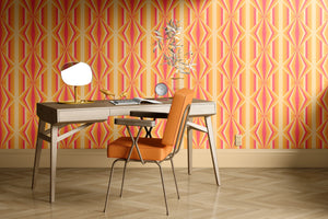 Deco Prism wallpaper by Liberty James Studio in orange, art deco wave stripes behind a desk in a home office