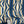 Deco Prism wallpaper by Liberty James Studio in teal and gold, sample roll showing art deco wave stripes
