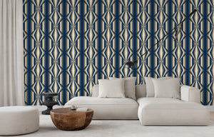 Deco Prism wallpaper by Liberty James Studio in teal and gold, art deco wave stripes behind a sofa in a living room