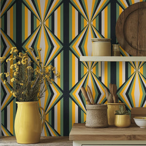 Deco Prism wallpaper by Liberty James Studio in yellow and green, art deco wave stripes above a sideboard