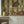 Deco Prism wallpaper by Liberty James Studio in yellow and green, art deco wave stripes in a kitchen