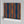 Deco Prism wallpaper by Liberty James Studio in multicolour, roll showing art deco wave stripes