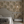 Aviary Isle wallpaper by Deus ex Gardenia in beige, birds among island flowers in a bedroom