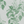 Aviary Isle wallpaper by Deus ex Gardenia in green, pattern sample of birds among island flowers