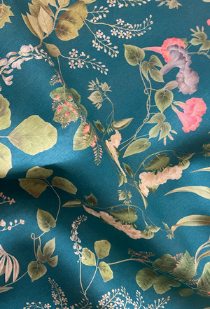Little Eden linen by Deus ex Gardenia in teal, in soft folds showing lush leaves and fruit
