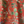 Little Eden linen by Deus ex Gardenia in orange, draped close-up of lush leaves and fruit