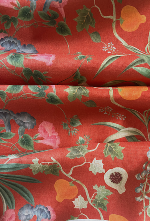 Little Eden linen by Deus ex Gardenia in orange, in soft folds showing lush leaves and fruit