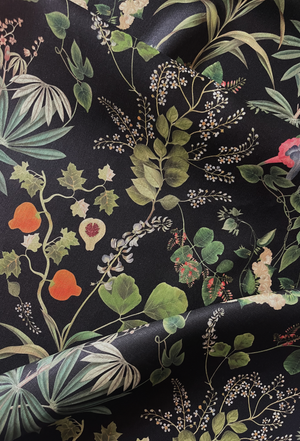 Little Eden linen by Deus ex Gardenia in black, in soft folds showing lush leaves and fruit
