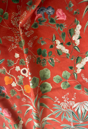 Little Eden velvet by Deus ex Gardenia in orange, draped, showing lush leaves and fruit