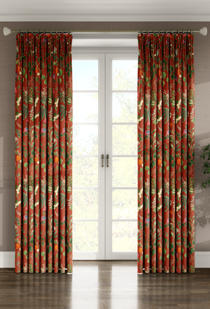 Little Eden linen by Deus ex Gardenia in orange, lush leaves and fruit as lined curtains