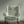 Little Eden velvet by Deus ex Gardenia in cream and green, lush leaves and fruit upholstered on an armchair