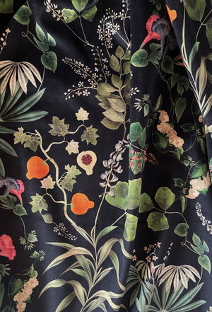Little Eden velvet by Deus ex Gardenia in black, draped close-up of lush leaves and fruit