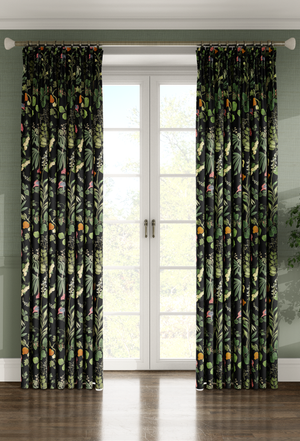 Little Eden linen by Deus ex Gardenia in black, lush leaves and fruit as lined curtains