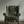 Little Eden velvet by Deus ex Gardenia in black, lush leaves and fruit on an upholstered chair
