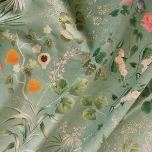 Little Eden velvet by Deus ex Gardenia in sage green, draped, showing lush leaves and fruit