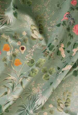 Little Eden velvet by Deus ex Gardenia in sage green, draped, showing lush leaves and fruit