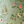 Little Eden velvet by Deus ex Gardenia in sage green, draped close-up of lush leaves and fruit
