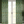 Little Eden linen by Deus ex Gardenia in sage green, lush leaves and fruit hung as curtains