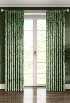 Little Eden linen by Deus ex Gardenia in sage green, lush leaves and fruit hung as curtains
