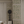 Little Eden wallpaper by Deus ex Gardenia in cream and green, lush leaves and fruit in a hallway