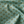 Little Palma linen by Deus ex Gardenia in sage green, draped close-up of rows of palm trees