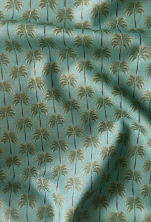Little Palma linen by Deus ex Gardenia in sage green, draped close-up of rows of palm trees