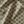 Little Palma linen by Deus ex Gardenia in pink and green, draped, showing rows of palm trees