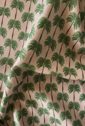 Little Palma linen by Deus ex Gardenia in pink and green, draped close-up of rows of palm trees