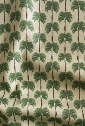 Little Palma linen by Deus ex Gardenia in beige and green, draped, showing rows of palm trees