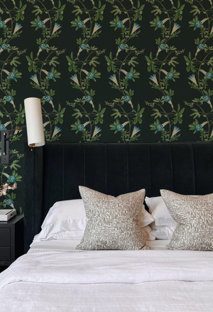 Midsummer wallpaper by Deus ex Gardenia in charcoal and green, trailing bellflowers on a bedroom wall