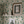 Midsummer wallpaper by Deus ex Gardenia in cream and blue, trailing bellflowers above a sideboard