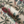 Passiflora linen by Deus ex Gardenia in cream, draped close-up of parrots and passion flowers