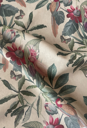 Passiflora linen by Deus ex Gardenia in cream, draped close-up of parrots and passion flowers