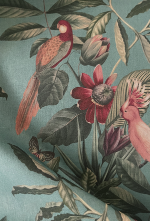Passiflora linen by Deus ex Gardenia in teal, in soft folds showing parrots and passion flowers