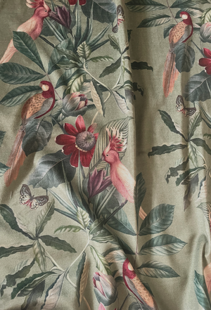 Passiflora velvet by Deus ex Gardenia in sage green, draped, showing parrots and passion flowers