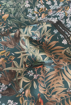 Resplendent Woods linen by Deus ex Gardenia in dark green, draped, showing peacocks and pheasants in trees