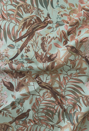 Resplendent Woods linen by Deus ex Gardenia in teal, draped, showing peacocks and pheasants in trees