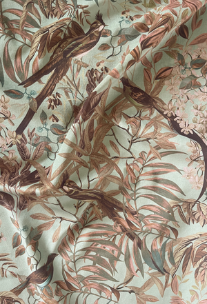 Resplendent Woods velvet by Deus ex Gardenia in teal, draped, showing peacocks and pheasants in trees